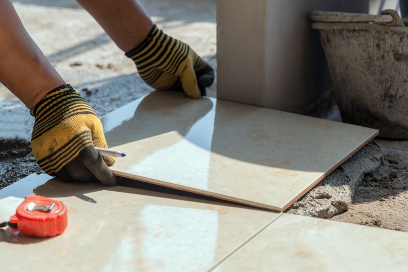 A contractor measuring for tile layout